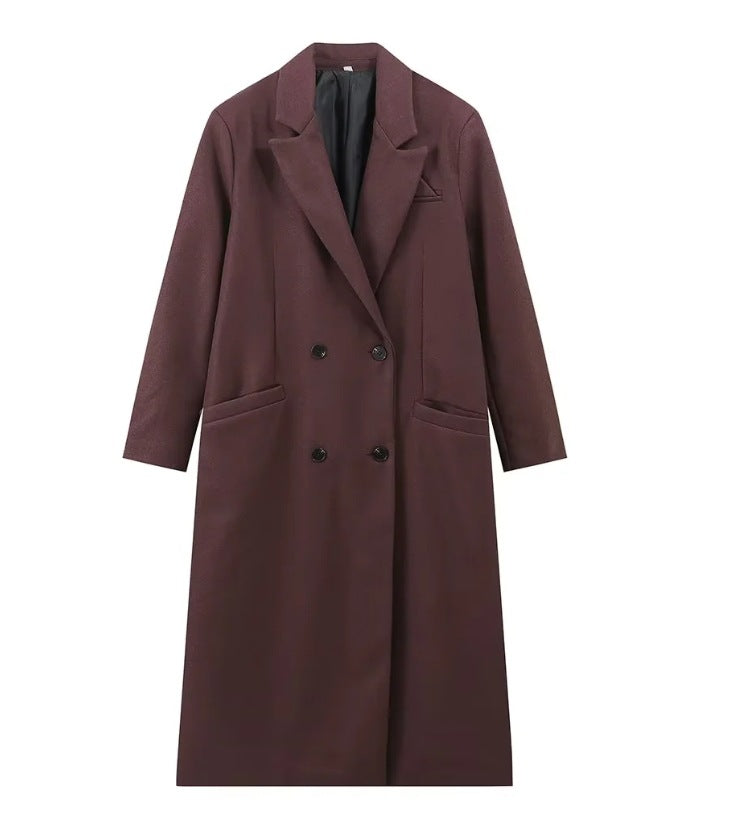 Double breasted coat with padded shoulders and lapel
