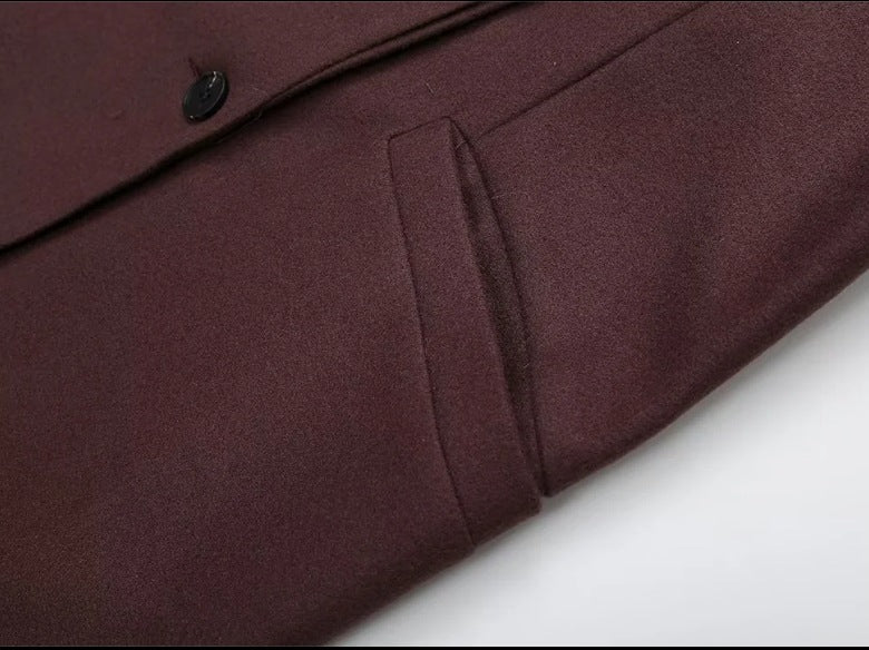 Double breasted coat with padded shoulders and lapel
