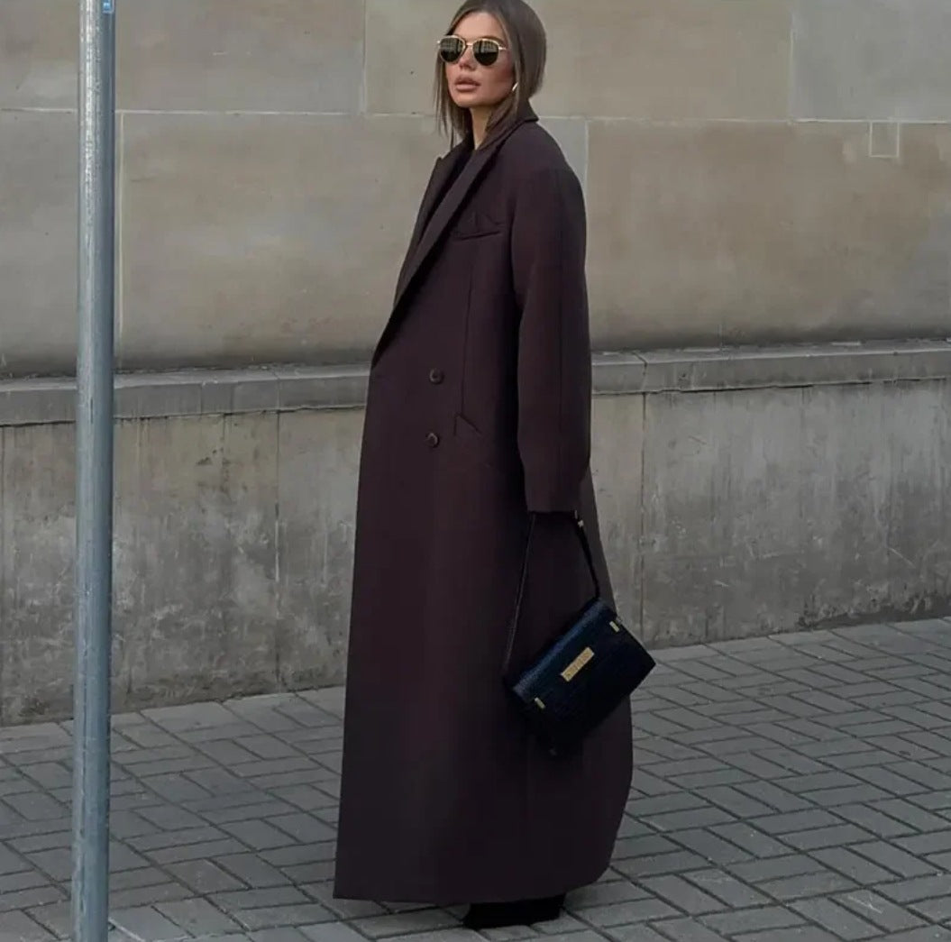 Double breasted coat with padded shoulders and lapel