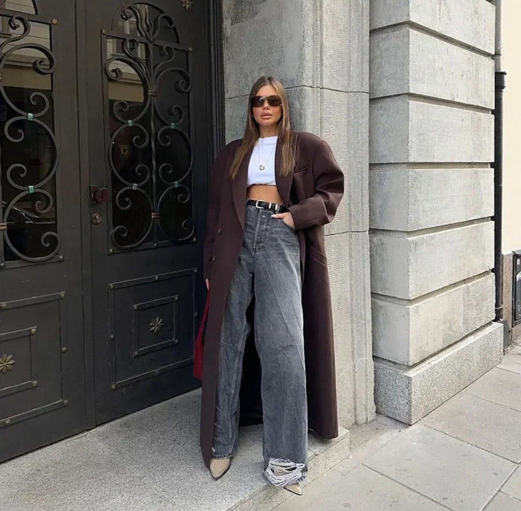 Double breasted coat with padded shoulders and lapel