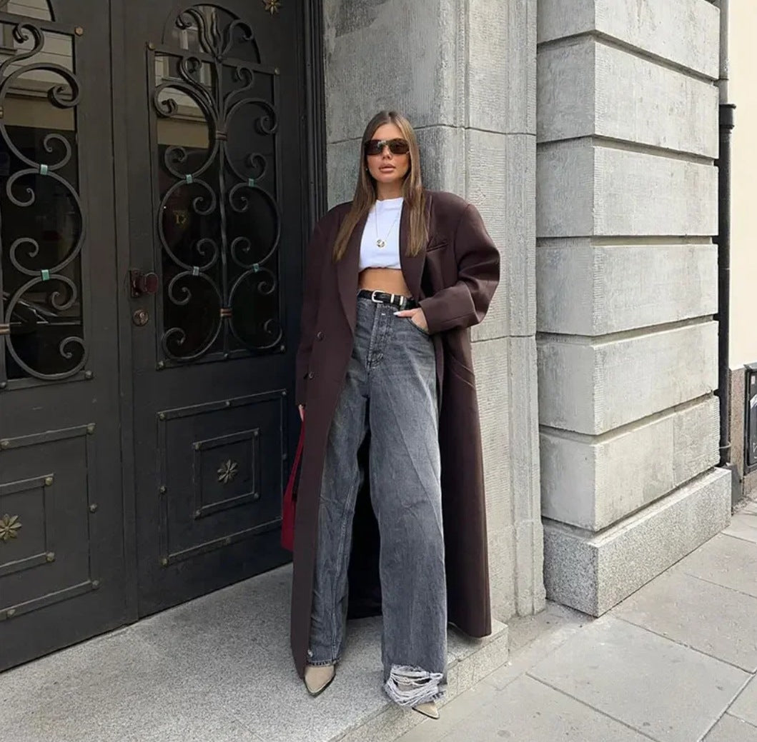 Double breasted coat with padded shoulders and lapel