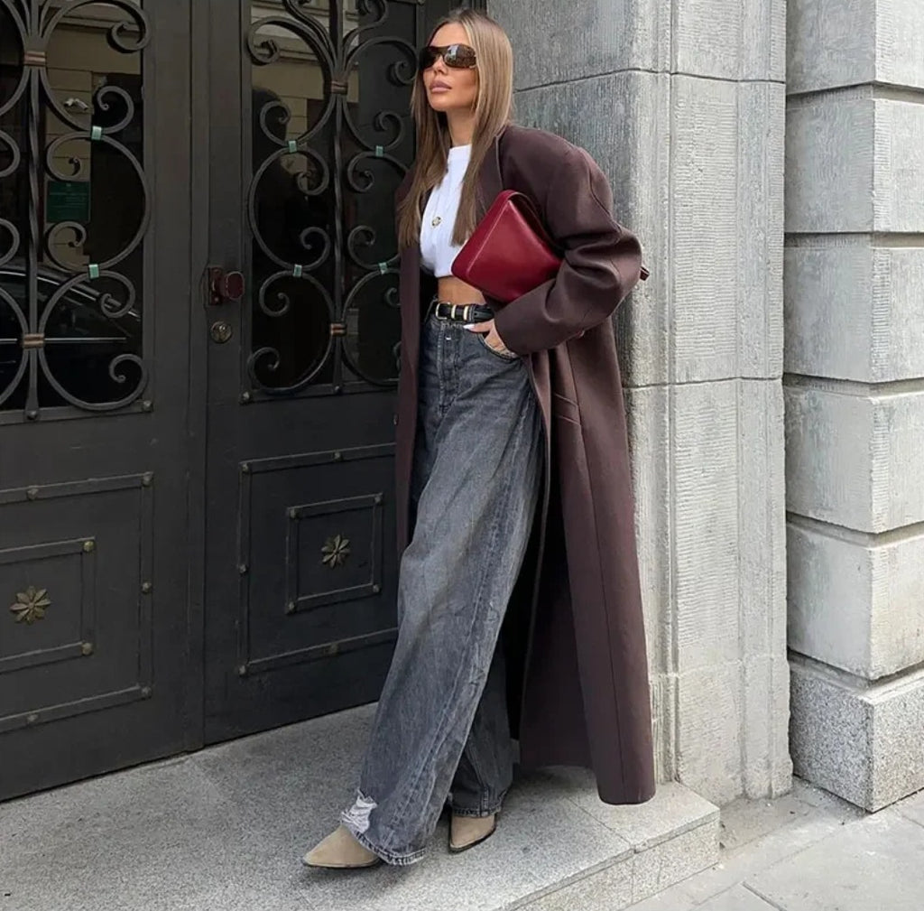 Double breasted coat with padded shoulders and lapel