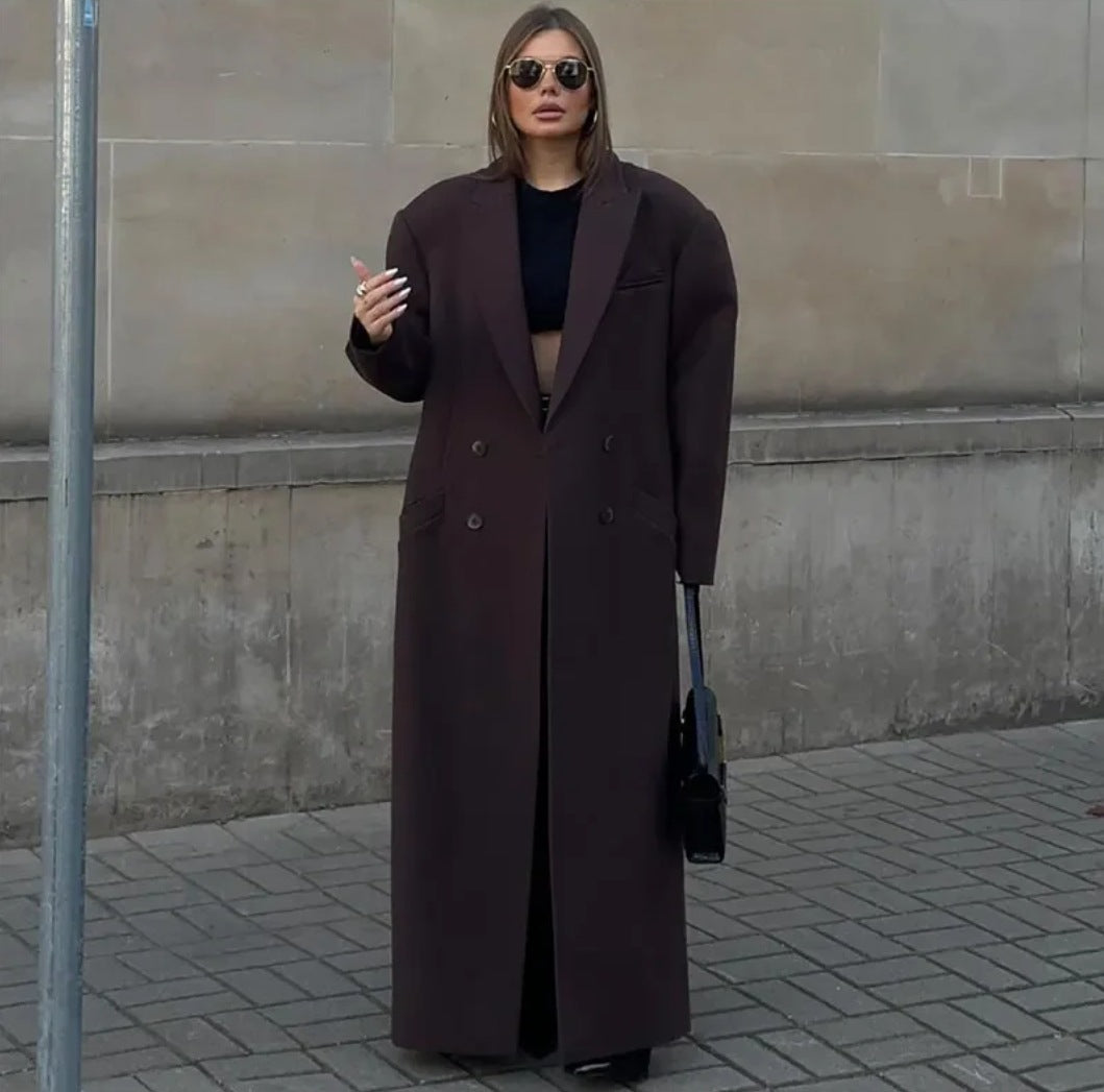 Double breasted coat with padded shoulders and lapel